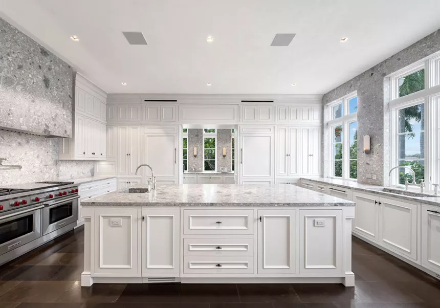Picture of a luxury kitchen with white furniture.