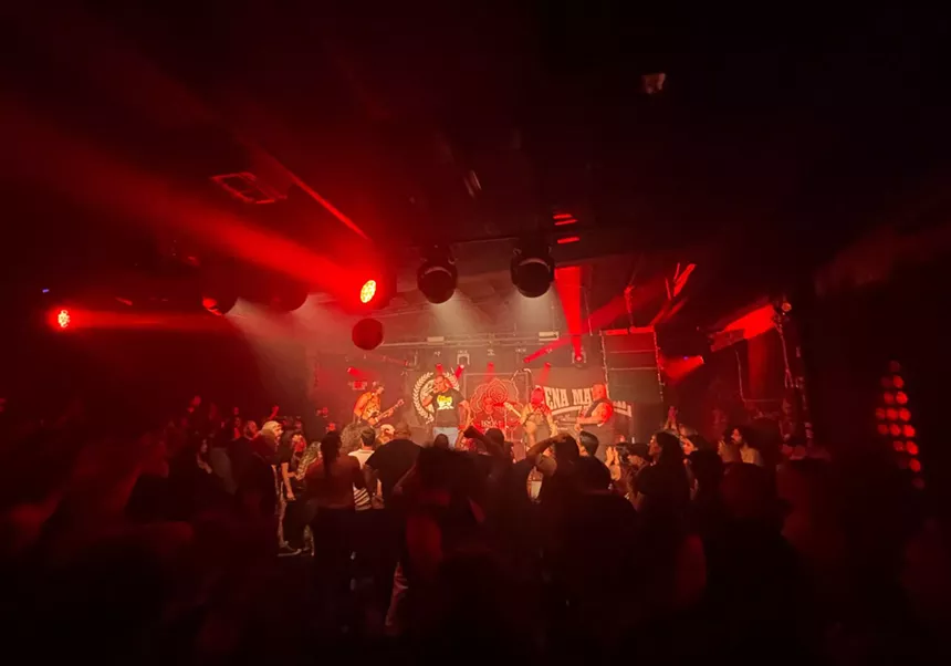 picture of a metal band playing in front of a crowd