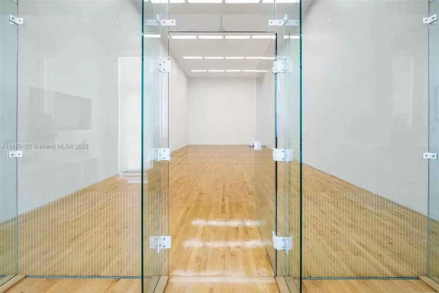Pictured is a shiny new indoor racquetball court.