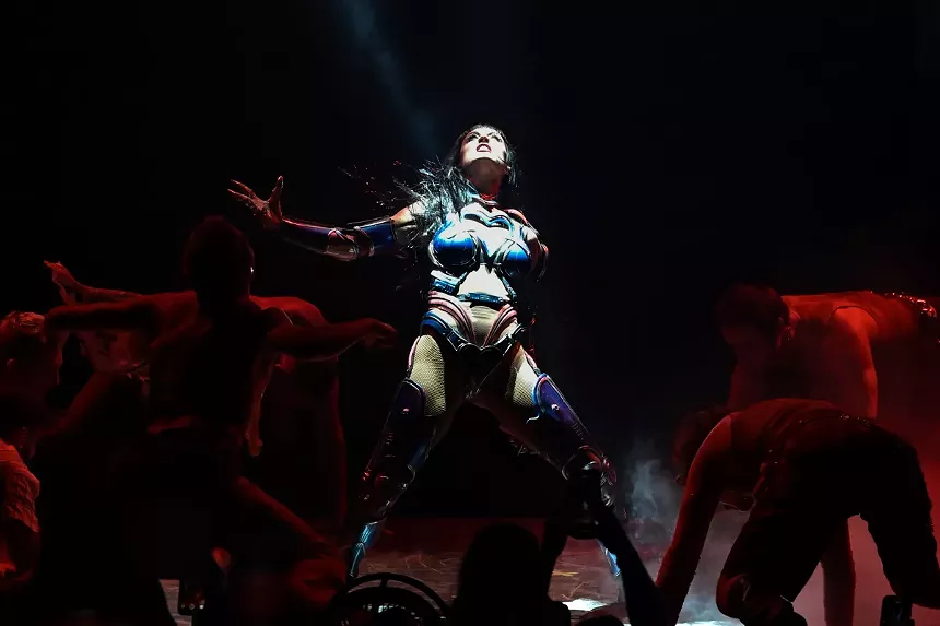 Picture of Katy Perry on stage dressed in a metal suit.