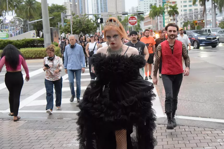Lady Gaga fan outside a Miami concert wearing a black dress and a tiara.
