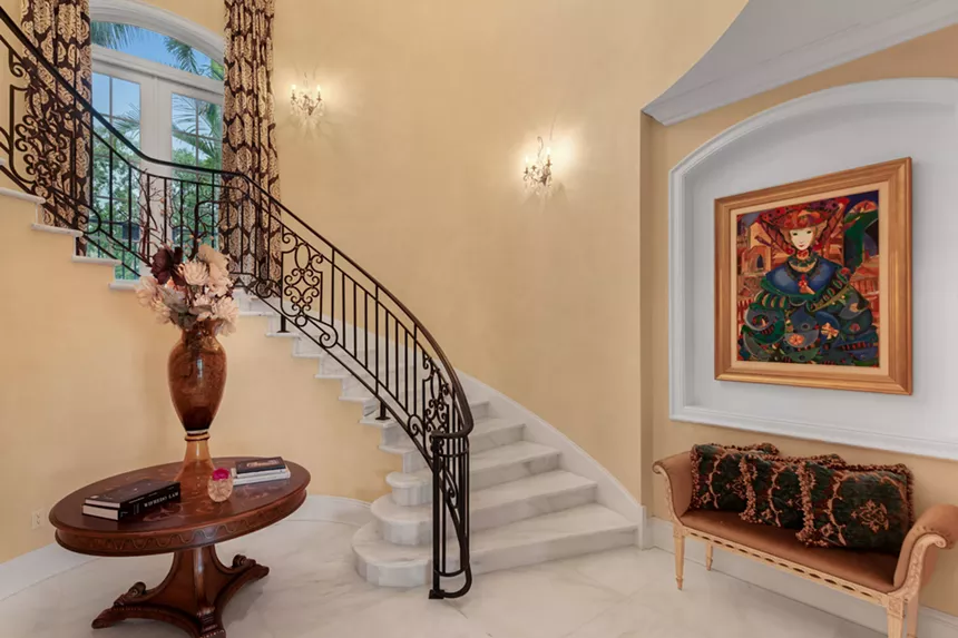 Stairway and entryway table inside the property