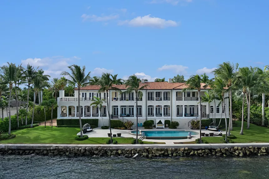 Backyard view of Coral Gables mansion on Biscayne Bay. It features a pool.