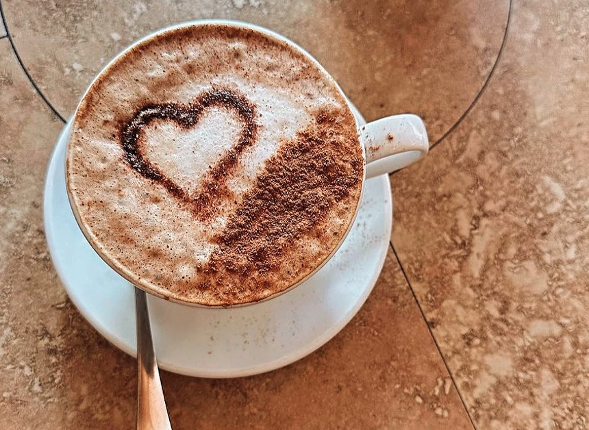 a latte with latte art shaped like a heart