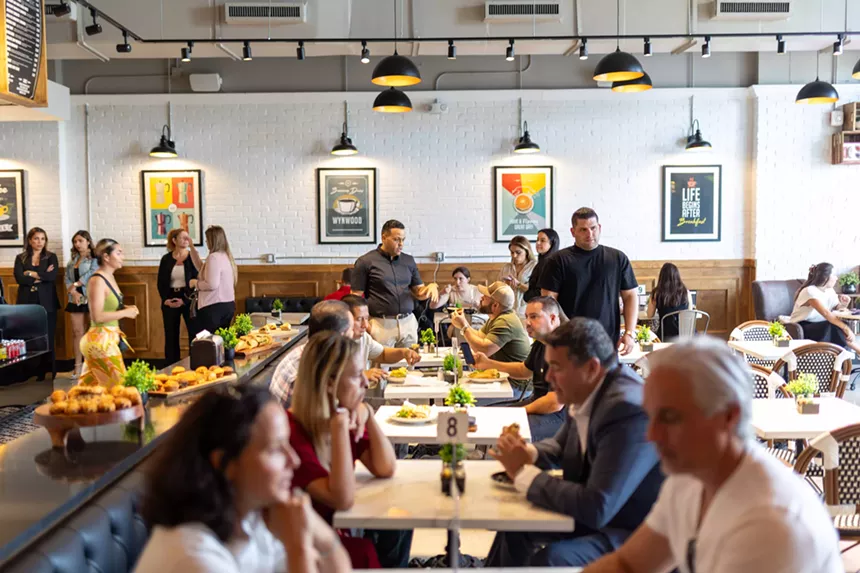 people sitting across from one another in a dining room
