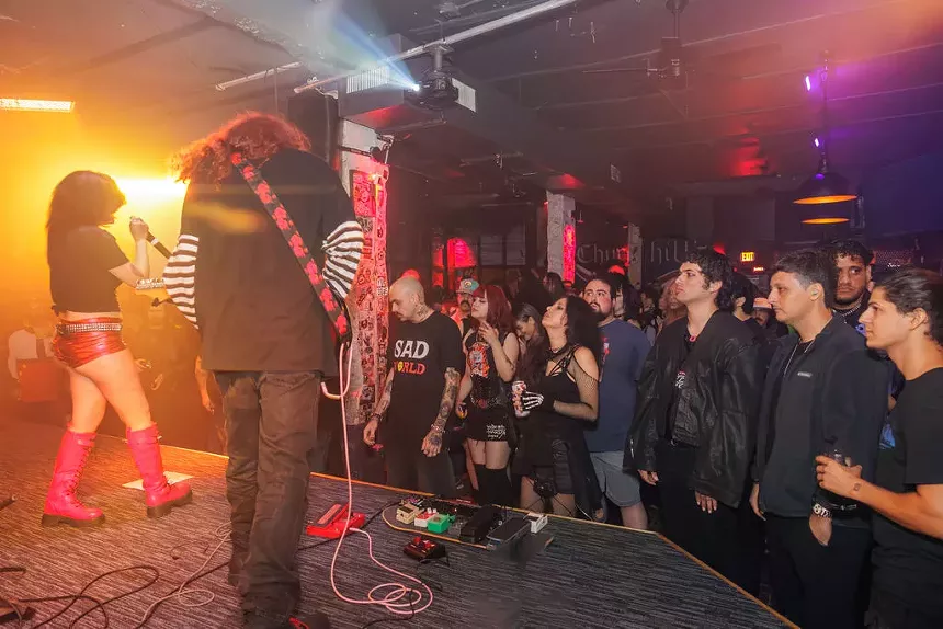 a punk band performing on stage