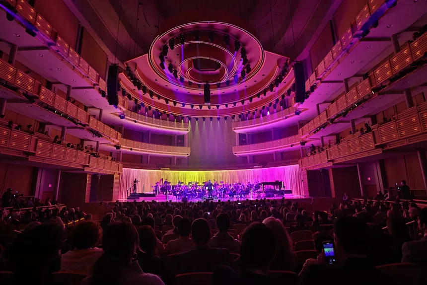 Picture of an orchestra performing on stage.