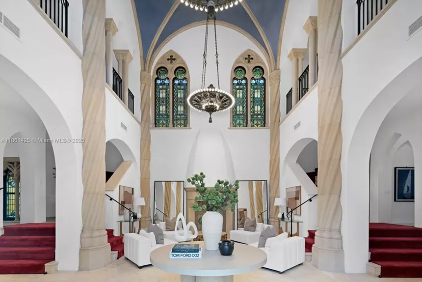 Depicted is a room with high vaulted ceilings and columns.