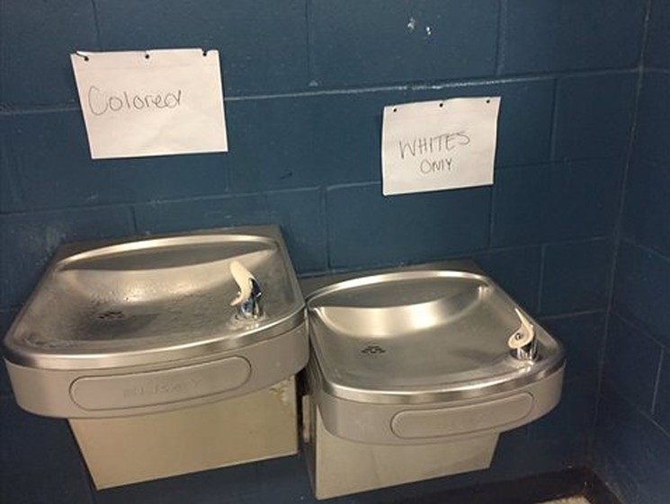 Homemade signs for "colored" and "white" water fountains at a Jacksonville high school. - PHOTO VIA PROPUBLICA