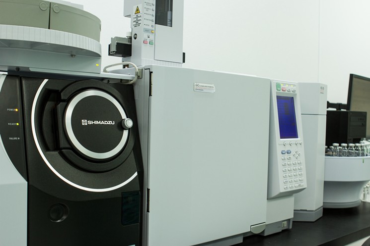 A Shimadzu gas chromatography mass spectrometer, one of the many top-of-the-line pieces of technology in the lab. - PHOTO BY TRAVIS COHEN