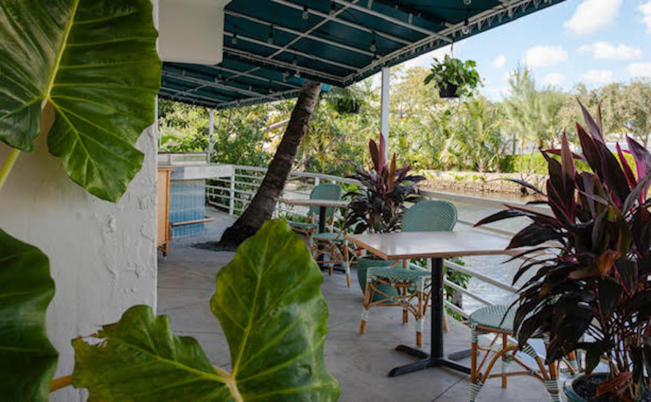 The outside patio at Cafe Kush offers a peaceful waterfront respite off Biscayne Boulevard.