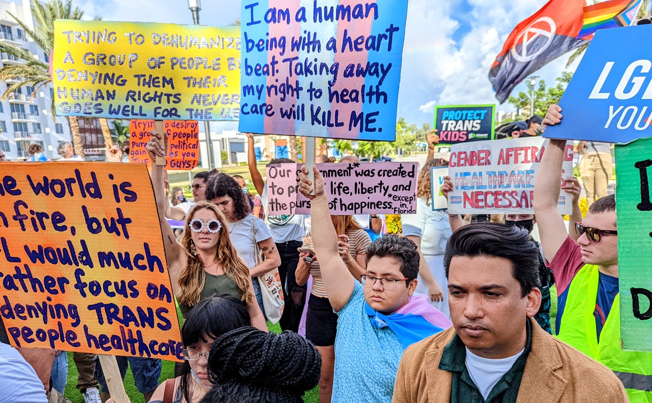 Protesters gather outside the Marriott Fort Lauderdale Airport hotel where the Florida Board of Medicine held a meeting on August 5, 2022, to consider proposed rules to ban gender-affirming medical care for minors.