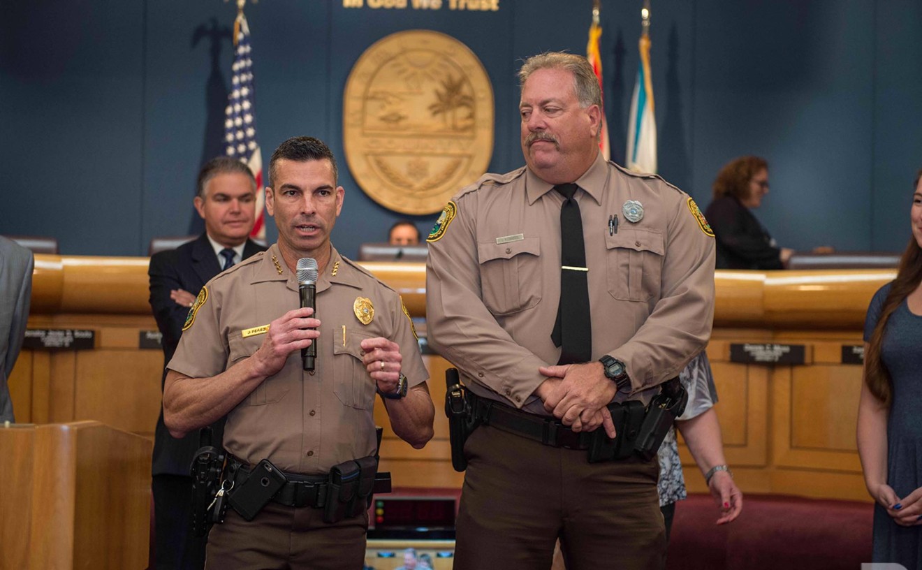 Miami-Dade County Police Director Juan Perez (left)