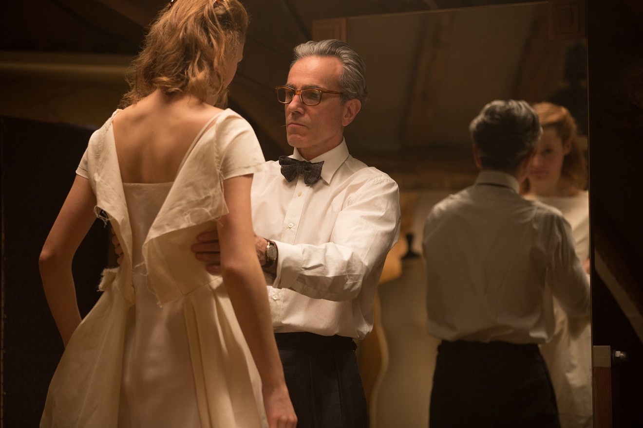 Daniel Day-Lewis (right) plays British fashion designer Reynolds Woodcock, who is immediately smitten with Alma (Vicky Krieps) in Phantom Thread, director Paul Thomas Anderson's  film that has the air of a chamber drama.