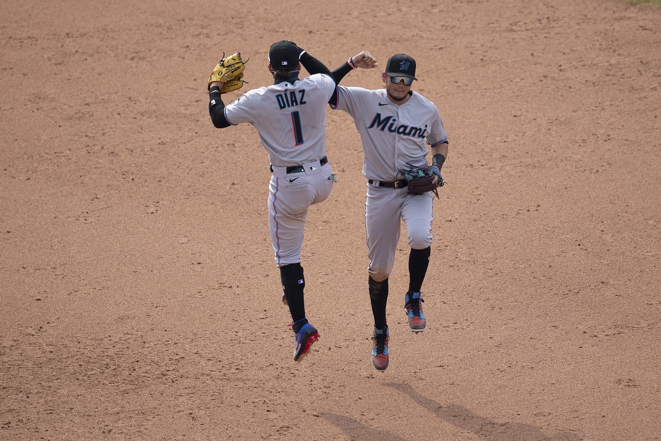 Isan Diaz and Miguel Rojas of the Miami Marlins celebrate their win against the Philadelphia Phillies.