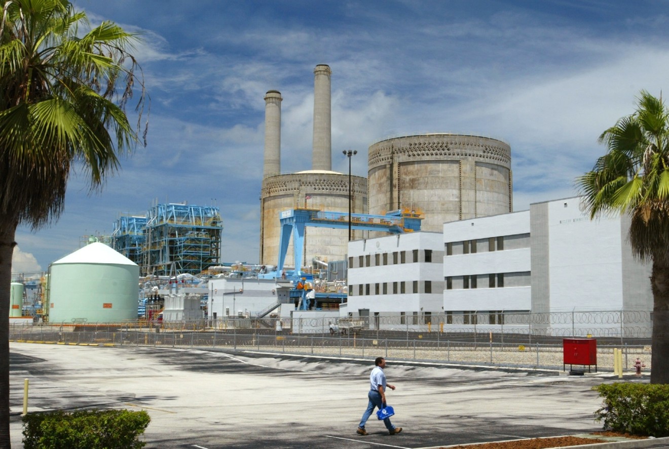 A worker walks past the Turkey Point Nuclear Power Plant.