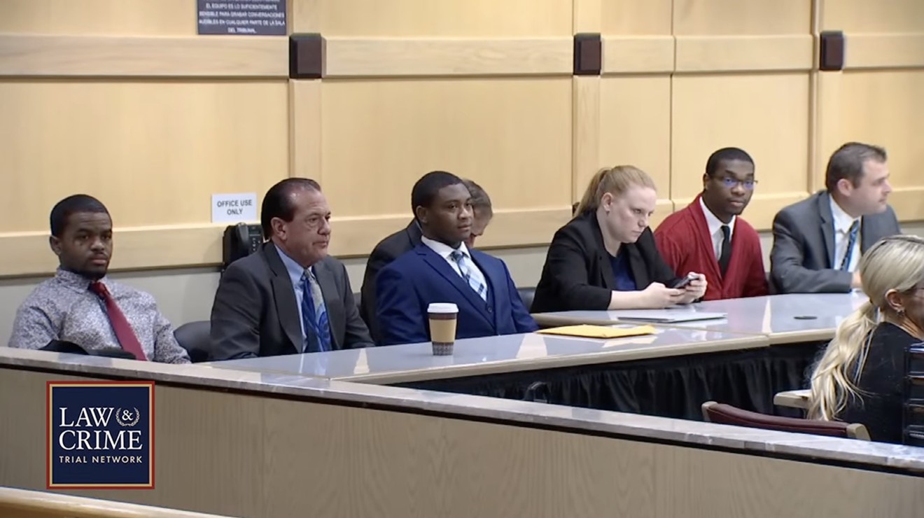Defendants Dedrick Williams (left), Trayvon Newsome (third from left), and Michael Boatwright (red jacket) await the jury's verdict.
