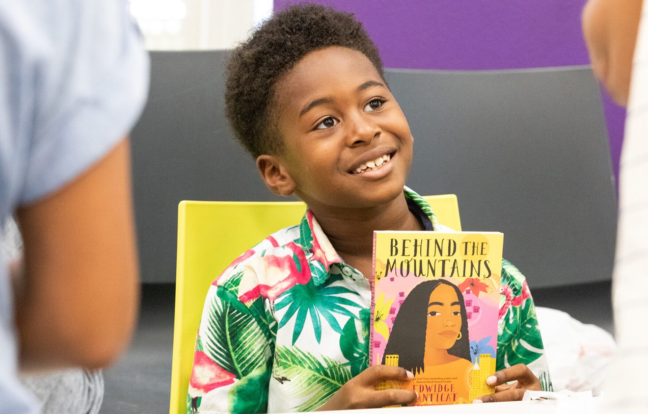 A young reader and his book during the 2022 Little Haiti Book Festival.