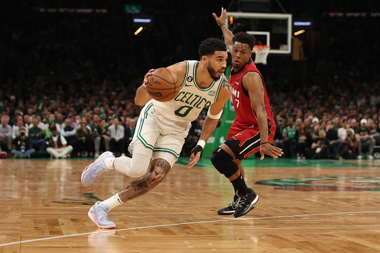 Jayson Tatum of the Boston Celtics drives around Kyle Lowry of the Miami Heat during Game 1 of the Eastern Conference Finals on May 17, 2023.