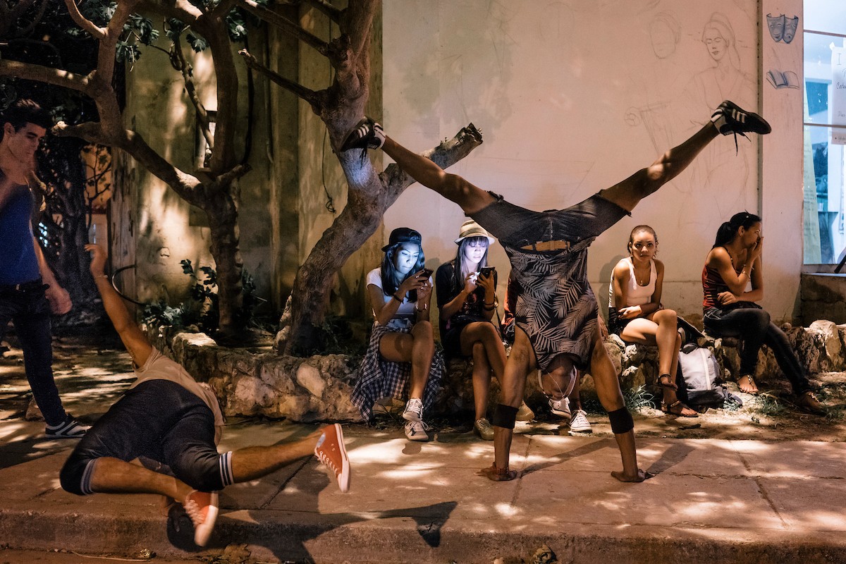 Break dancers warm up for an exhibition dance battle in front of Catedral del Picadillo, a multipurpose center in the Havana neighborhood of Jaimanitas. See more photos from photographer Greg Kahn's book, Havana Youth.