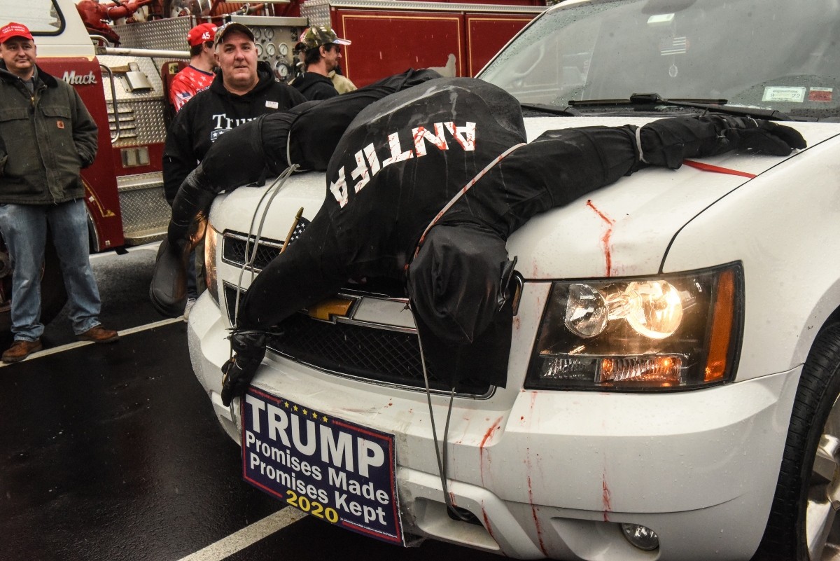 A Trump supporter with a dead antics effigy strapped to his car attends a pro-Trump rally in West Nyack, New York, on November 1, 2020.