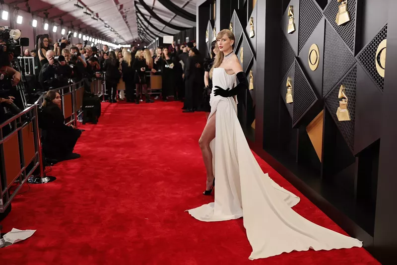 Image: taylor swift in a white dress on the white carpet