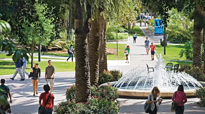 A photo of students wallking on the University of Miami campus in Coral Gables.