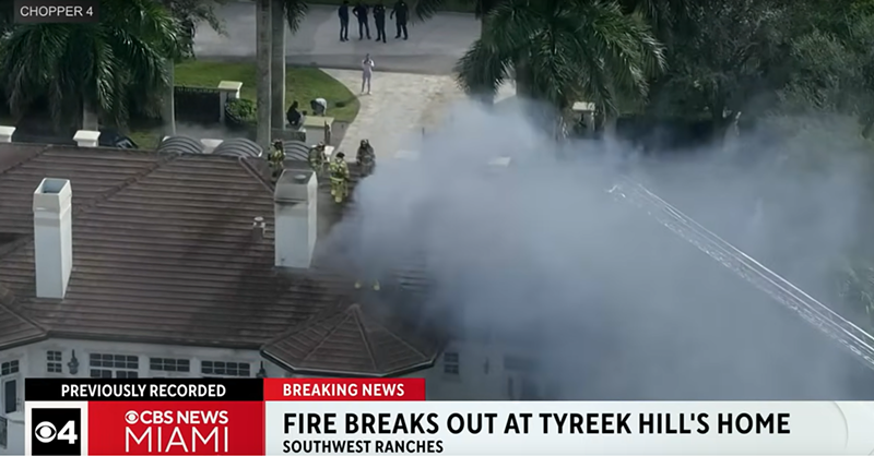 Firefighters extinguish a blaze at the mansion of Miami Dolphins wide receiver Tyreek Hill on January 3, 2024.