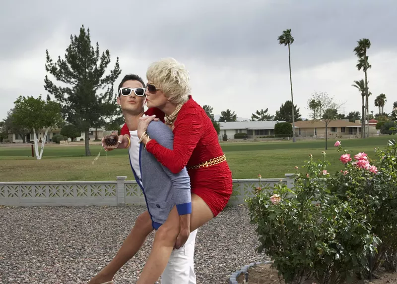 Image: Older woman on the back of a younger man
