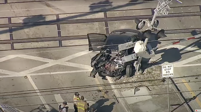 A wrecked car that was just hit by a Brightline train.