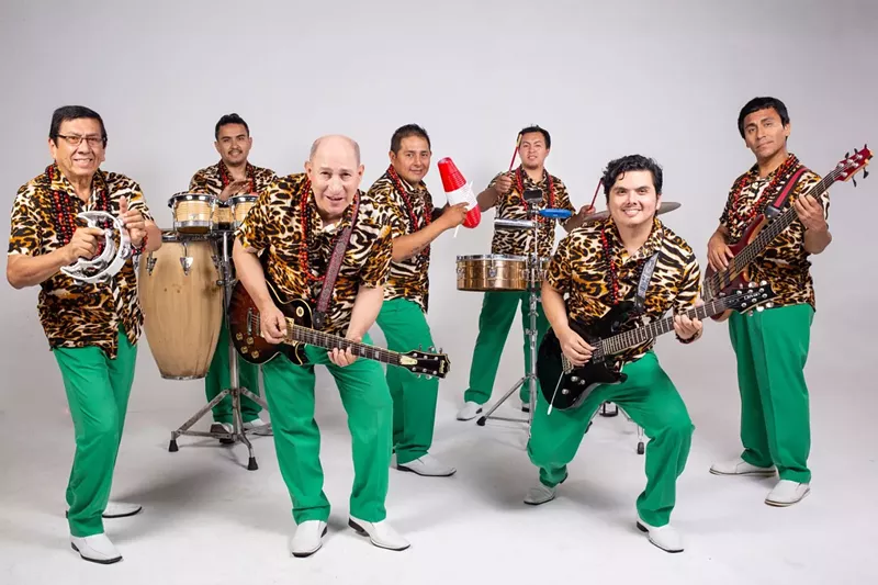 Image: Picture of a seven piece tropical band.