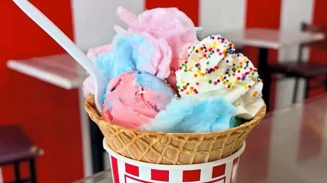 three ce cream scoops in a cne