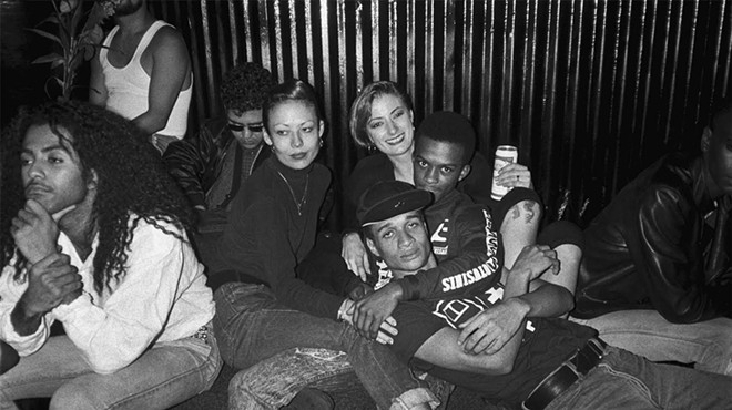 Partygoers staring at the camera on the closing night of Paradise Garage in New York City in 1987.