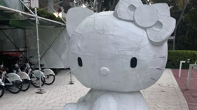 a Hello Kitty fountain with water pouring out of its eyes