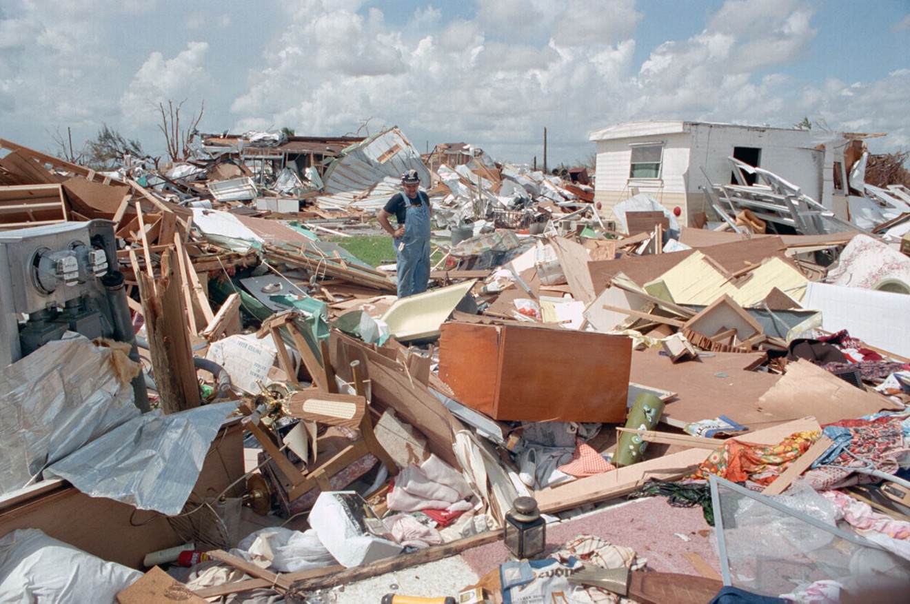 In September 1992, days after Hurricane Andrew struck, a man stares at the remains of his home. Take a look back at more of Andrew's devastation from 25 years ago.