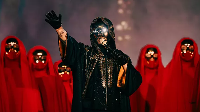 Singer the Weeknd performs in futuristic garb on stage