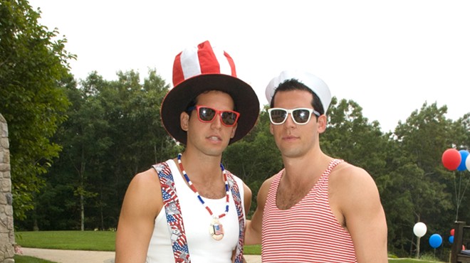 The Alexander twins dressed in patriotic costumes outside a large mansion