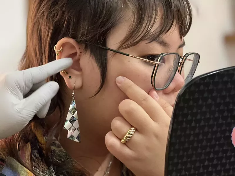 Image: The author being pierced by Rita Martinez