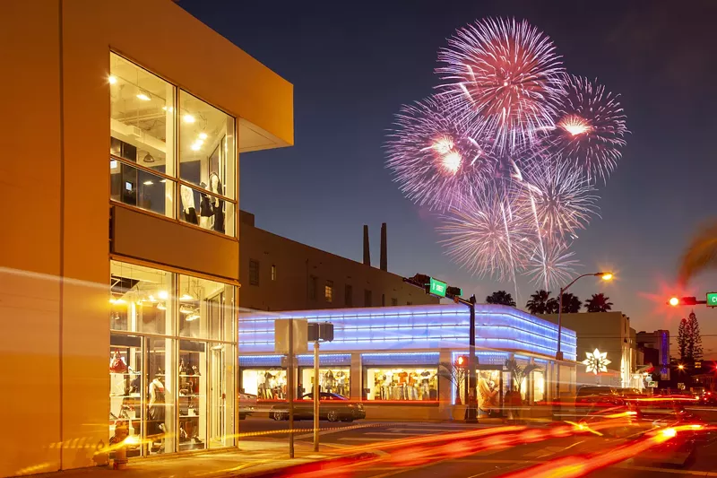Image: color photo of fireworks over buildings in Miami Beach, Florida.