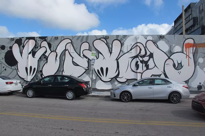 Image: OG Slick's mural on the Museum of Graffiti's west wall.