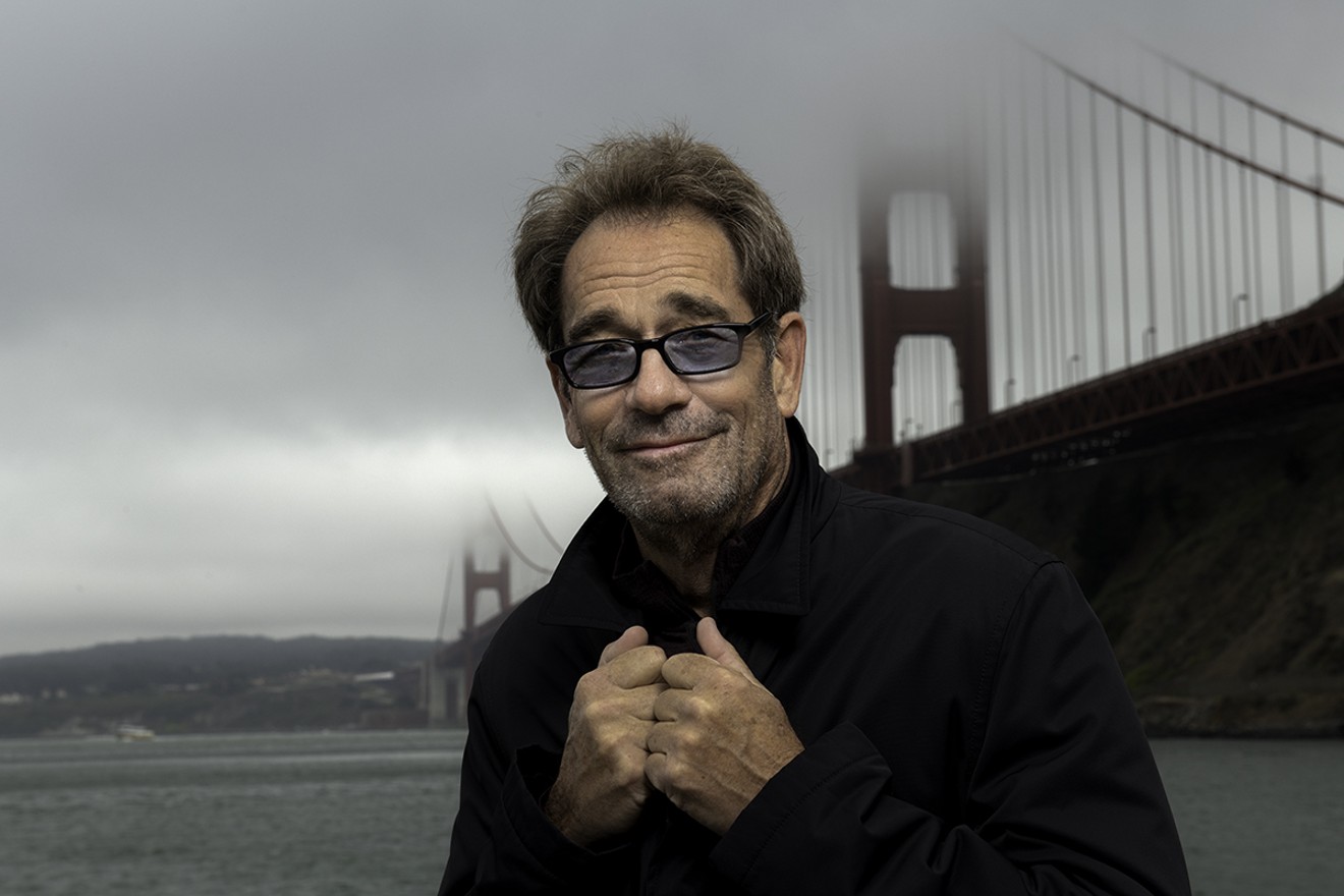 Workin' for a livin': Huey Lewis leads this year's '80s-themed Winterfest Boat Parade.