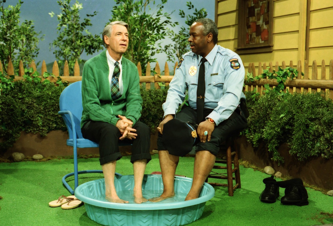 Won’t You Be My Neighbor? is a documentary that paints a flattering portrait of Fred Rogers (left), who doesn't mind getting his feet wet with Officer Clemmons (François Clemmons) in a 1969 episode of Mister Rogers’ Neighborhood.